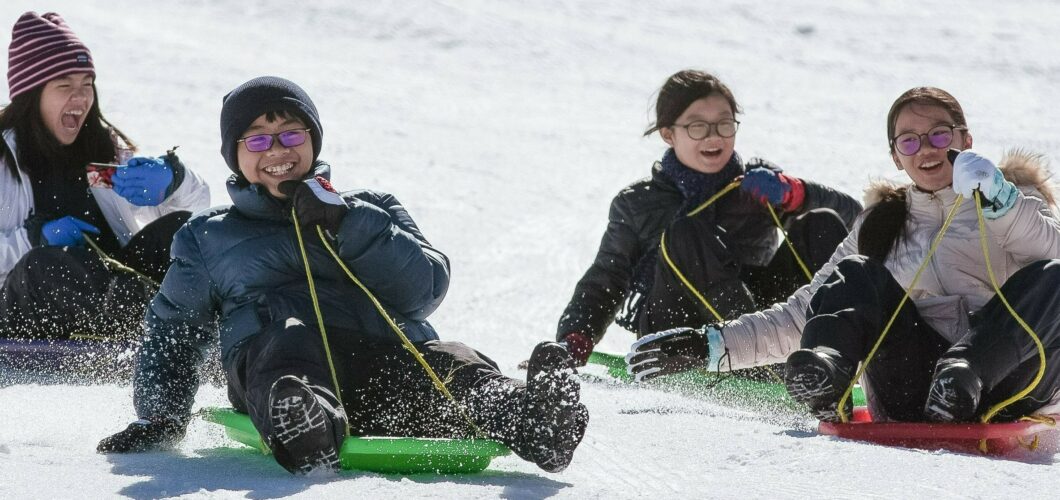 Kids celebrating opening weekend of the Snow Season in The Lake Mountain Alpine Resort