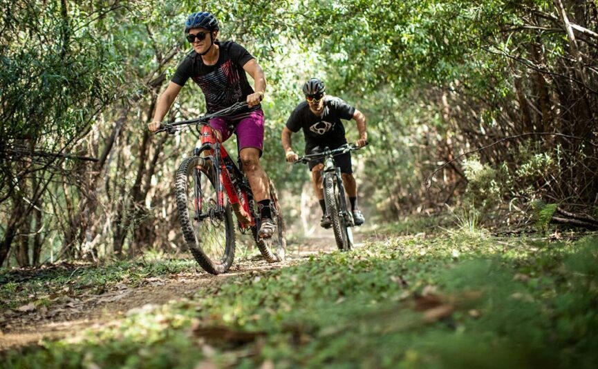 multiple people riding on the mountain bike trail in lake mountain