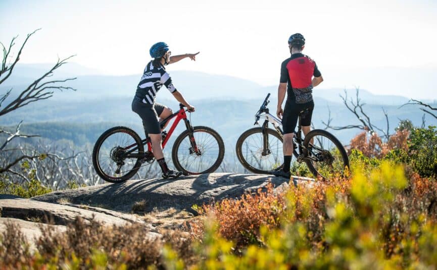 Two people on bikes on the mountain