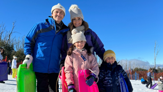 family with toboggans