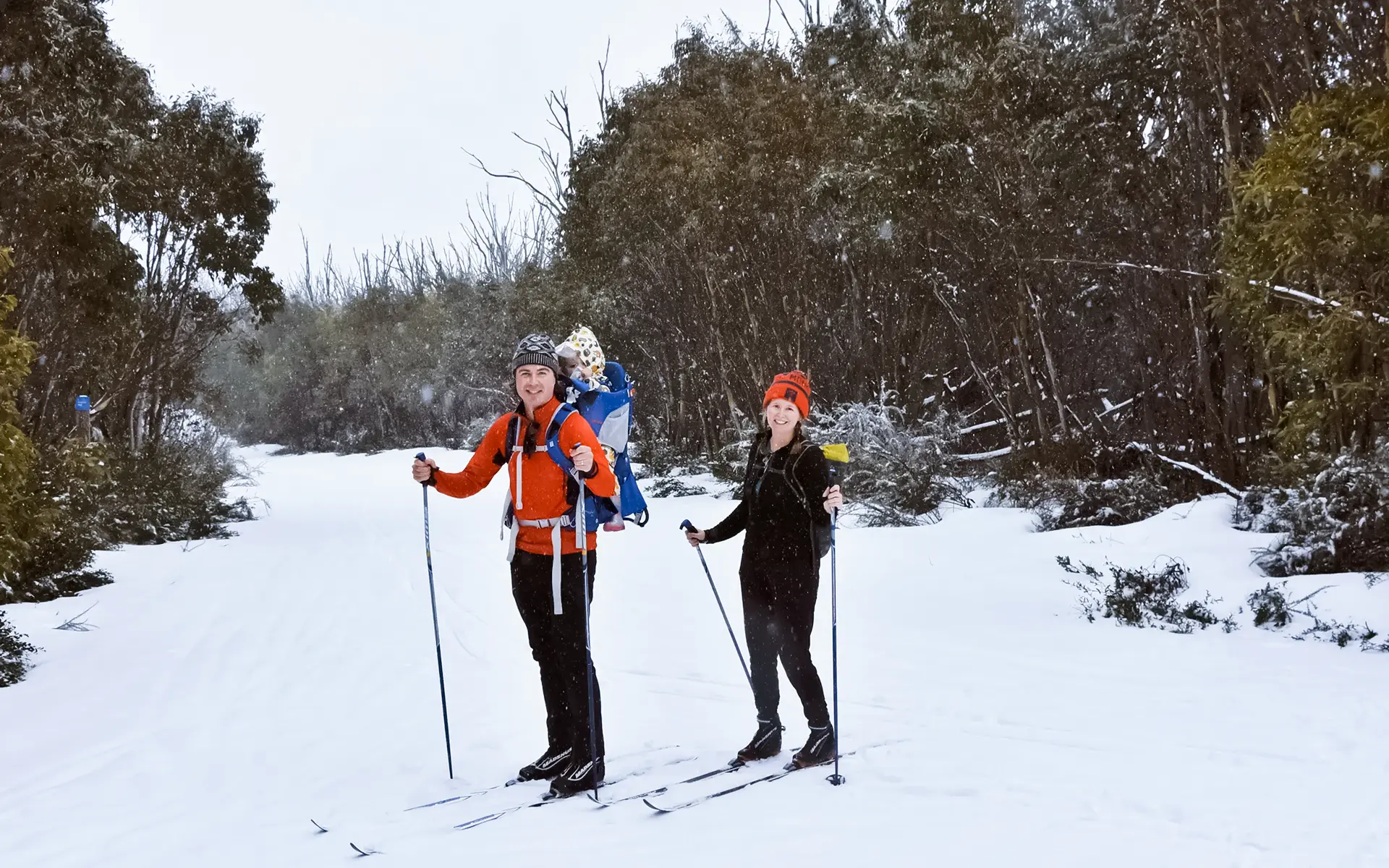 Man and woman cross-country skiing